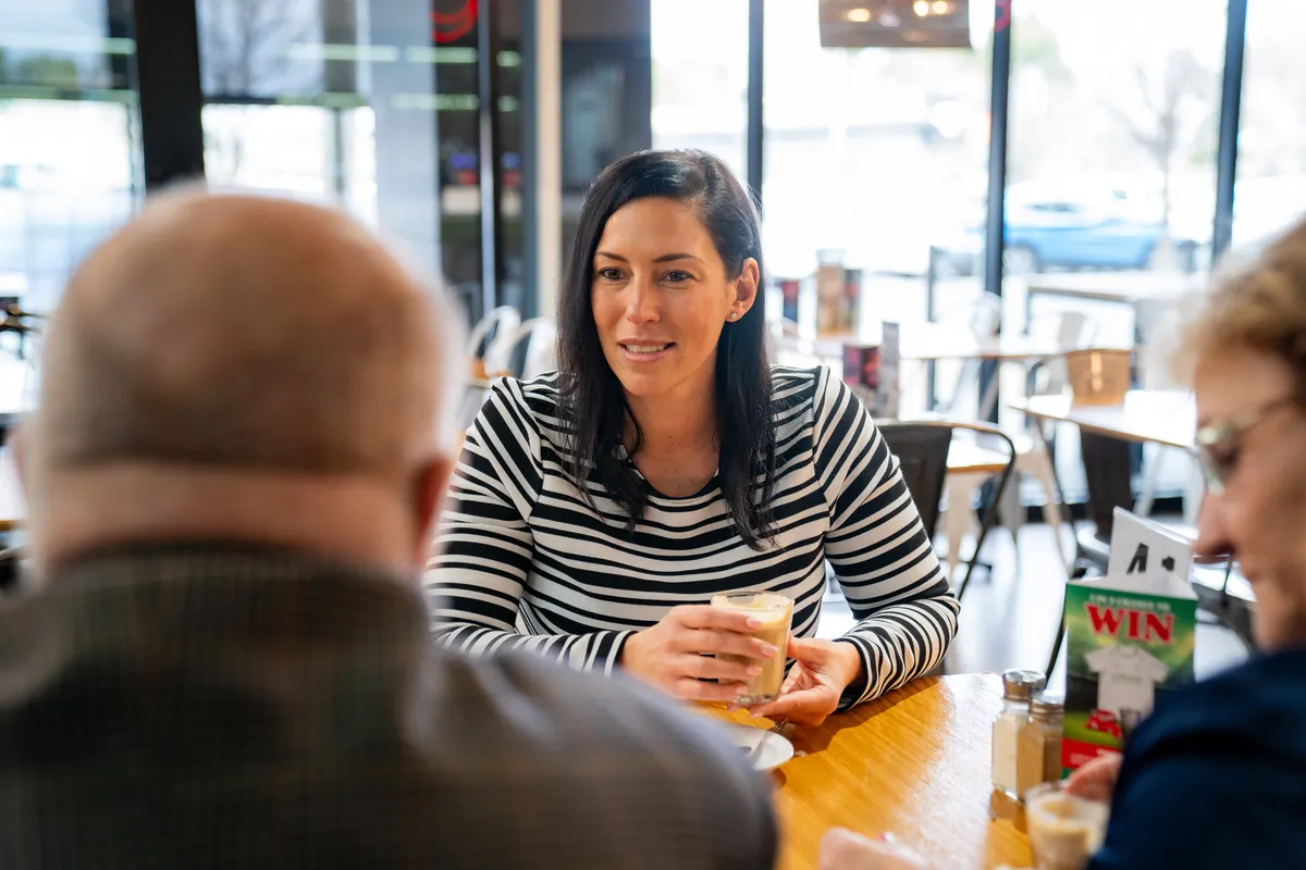 Luba Grigorovitch having a coffee with local residents